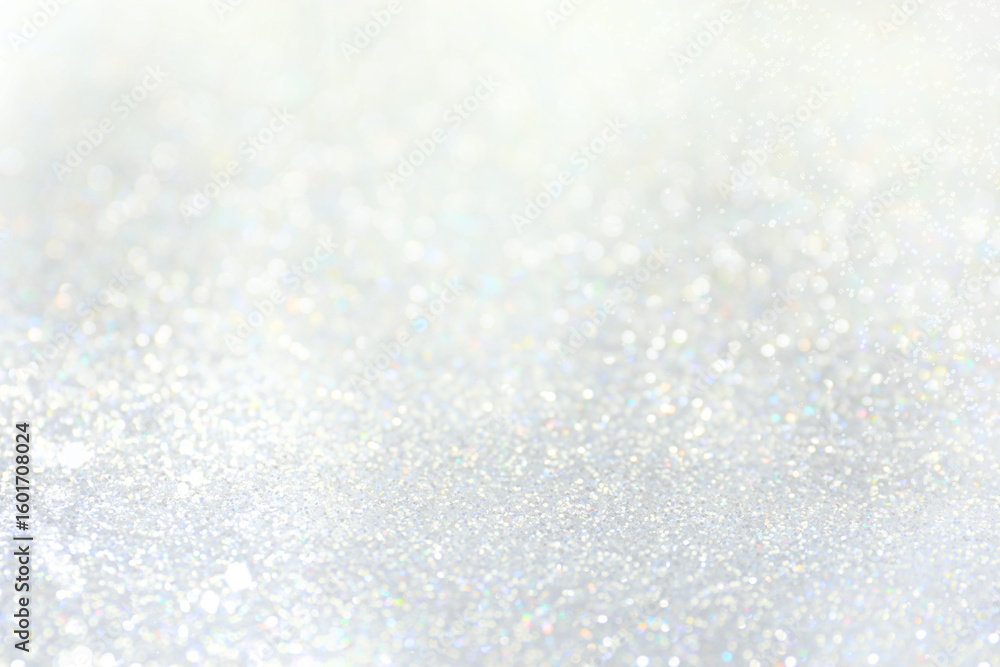 Obraz premium Shiny silver background with sparkling glitter, bokeh effect