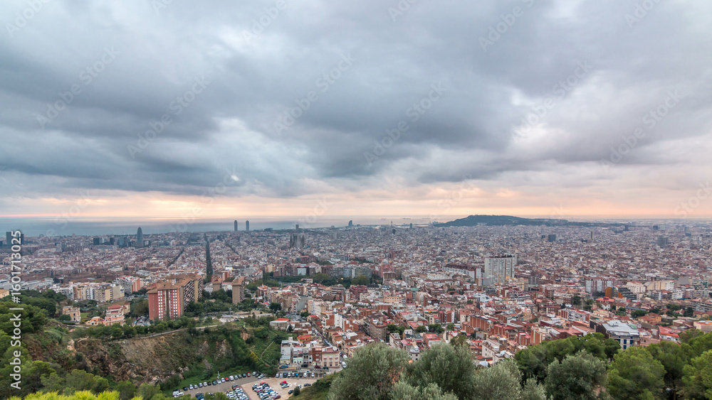Fototapeta premium Panorama of Barcelona timelapse, Spain, viewed from the Bunkers of Carmel