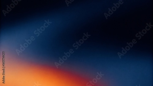 Warm orange glow fades into deep blue night sky with subtle grain
