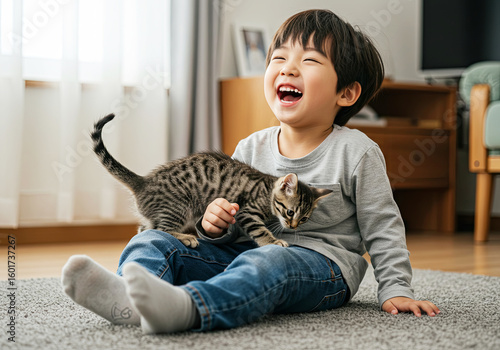 Child and Kitten Playtime. Joyful Moments. Furry Fun with a Tiny Friend. August 8 International Cat Day