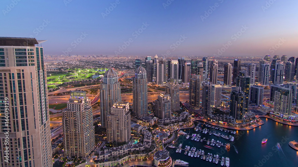 Fototapeta premium Dubai Marina with yachts day to night aerial timelapse