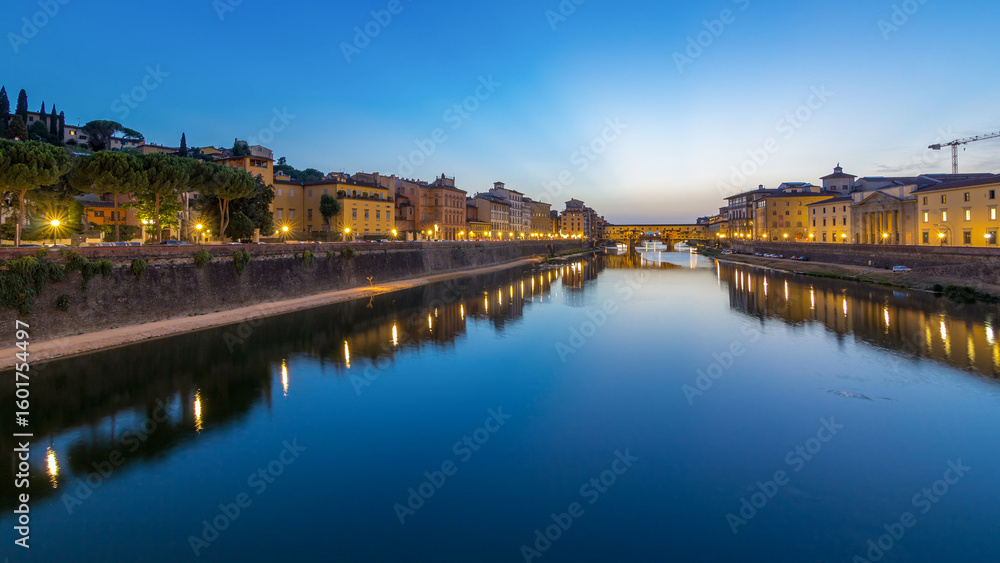 Fototapeta premium River Arno and famous bridge Ponte Vecchio day to night timelapse after sunset in Florence, Tuscany, Italy