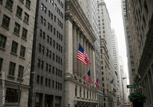 Iconic new york city wall street buildings with american flag flying proudly
