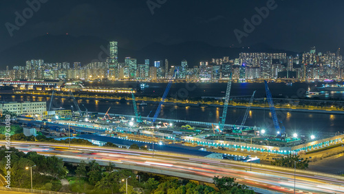 Canvas Print Top view of Hong Kong at night, aerial view from Kowloon bay downtown timelapse