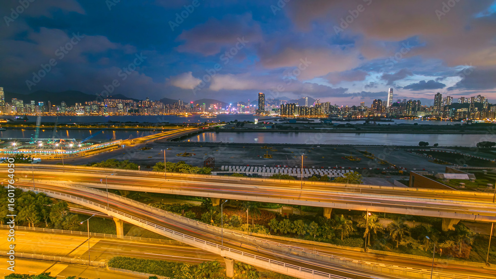 Fototapeta premium Hong Kong day to night, aerial view from kowloon bay downtown timelapse