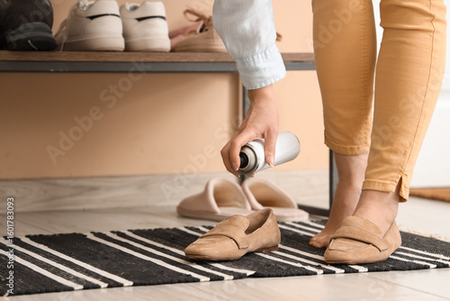 Woman applying water repell...