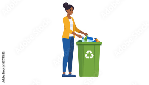 Smiling African American woman in a yellow cardigan recycling waste into a green bin.