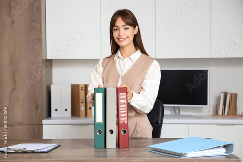 Young businesswoman with fo...