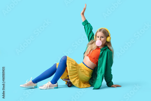 Cute trendy girl in headpho...