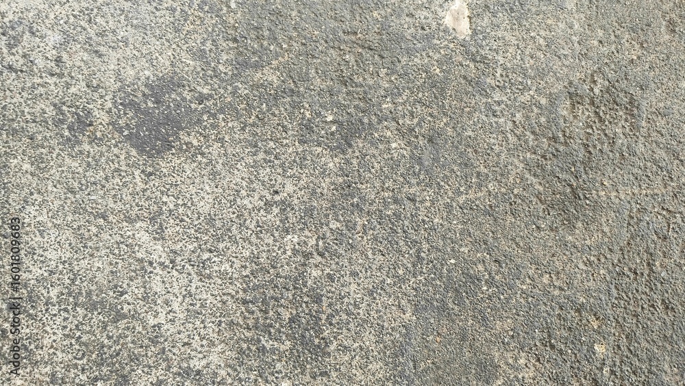 Rough grey wall surface texture.concrete wall texture. Background of old cement texture in car workshop. Closeup cement road floor. large and small stone textures.