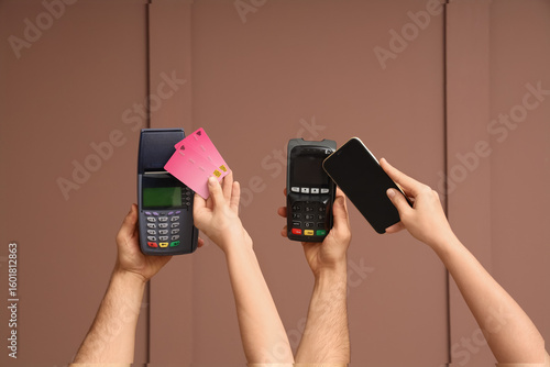 Hands with payment terminal...