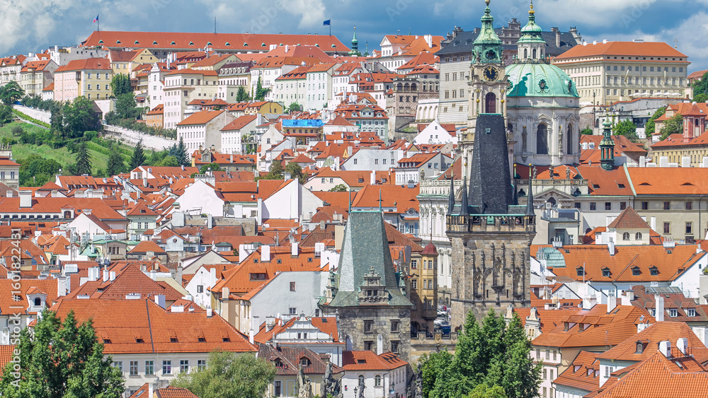 Obraz premium Charles Bridge Karluv Most and Lesser Town Tower timelapse, in the background St. Nicholas church and the castle