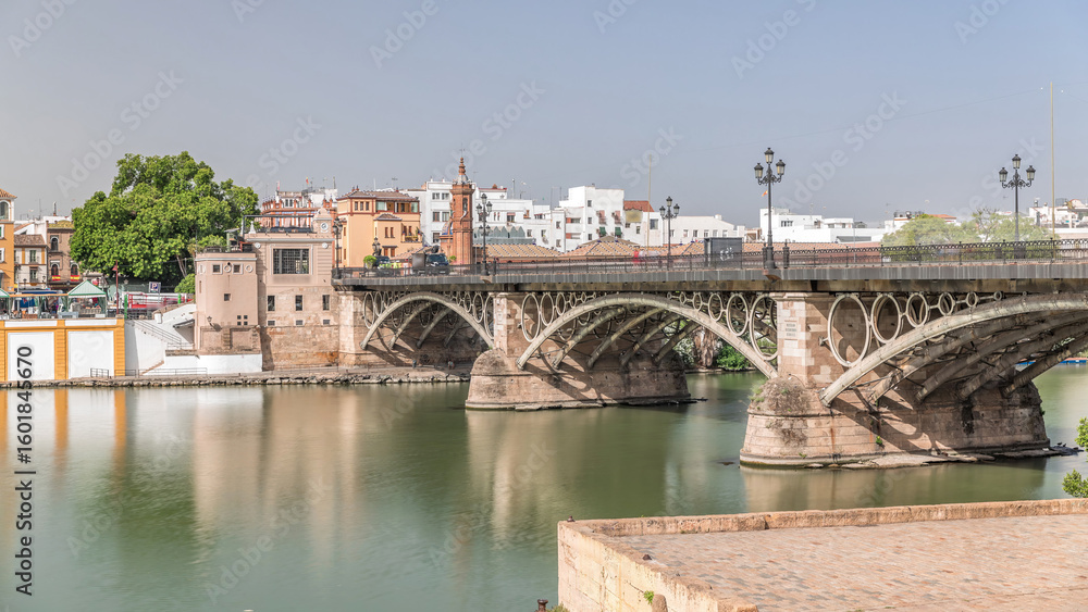 Naklejka premium Puente de Isabel II bridge timelapse hyperlapse over the Guadalquivir River, Seville, Spain