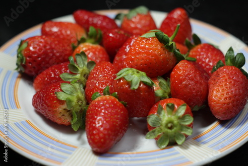 many strawberries on a plate