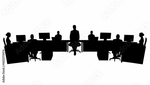 Silhouette of people sitting at desks with computers in an office setting with a supervisor standing