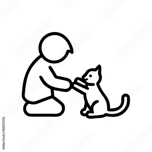 Child interacting with cat while sitting on the floor indoors  