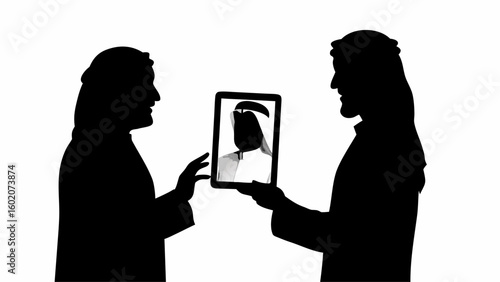 Two men in silhouette sharing a tablet displaying a portrait of a person wearing a traditional headdress