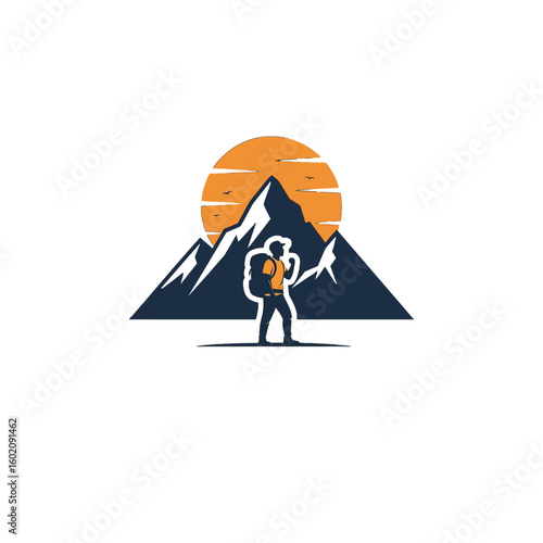 Silhouette of a hiker standing before mountain peaks and the setting sun.