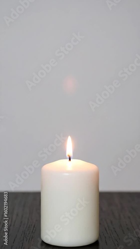 Wallpaper Mural Single white candle on dark wooden surface Torontodigital.ca