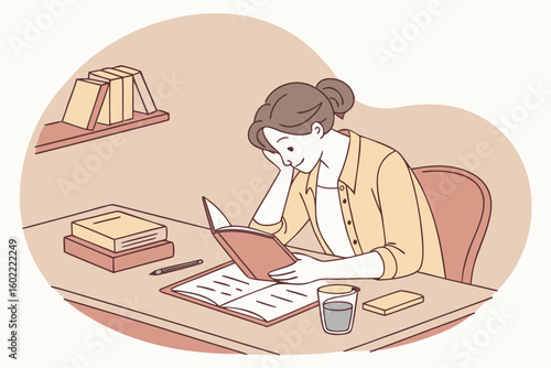 Focused woman reading a book in a cozy workspace with warm colors and bookshelves nearby