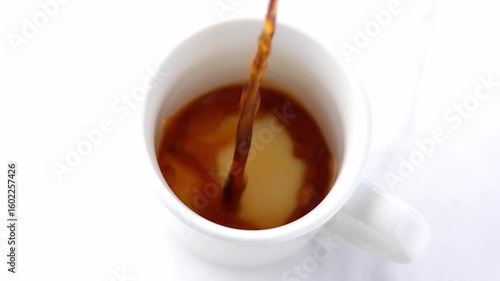 Hot Coffee Pouring in a cup, Slow Motion