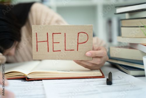 student woman have anxiety because of exams, female hold help in the library. stress, despair, haste, misunderstanding reading, discouraged, expectation, knowledge