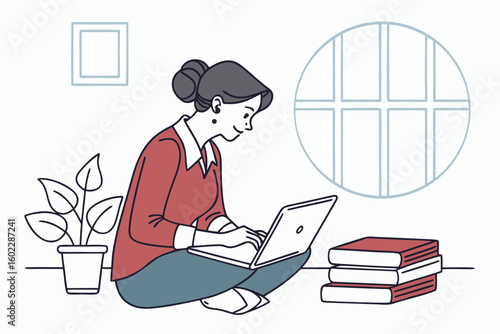 Woman working on laptop while sitting cross-legged on the floor surrounded by books and a plant in a bright, cozy interior space during the day