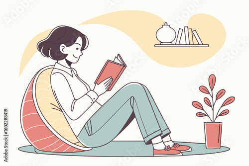 Cozy indoor moment of a person reading a book while seated on a floor cushion in a minimalist living space with a decorative plant nearby