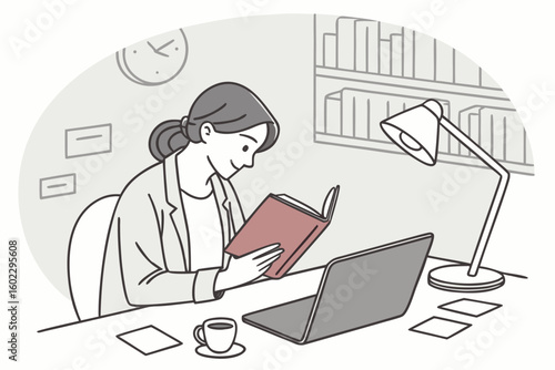 Engaging in reading while working at a desk with a laptop, coffee, and warm lighting in a cozy interior setting during the day