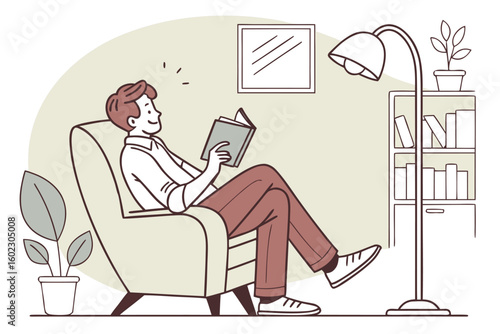 Young man reading a book while relaxing in a cozy chair with stylish lamp and bookcase nearby in a comfortable living room setting