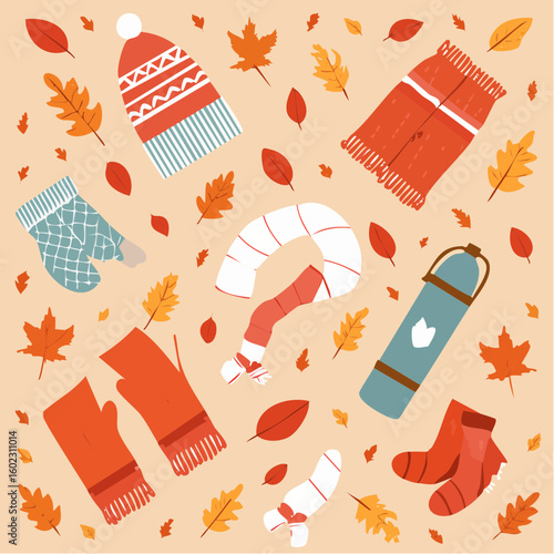 A cozy collection of autumn and winter clothing accessories including hats, scarves, gloves, and socks, scattered among colorful fallen leaves on a light background.