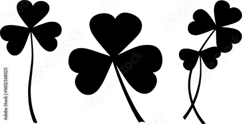 set of A black and white silhouette of a three leaf clover
. on white background