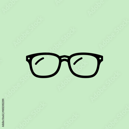 Eyeglasses icon in black on green background