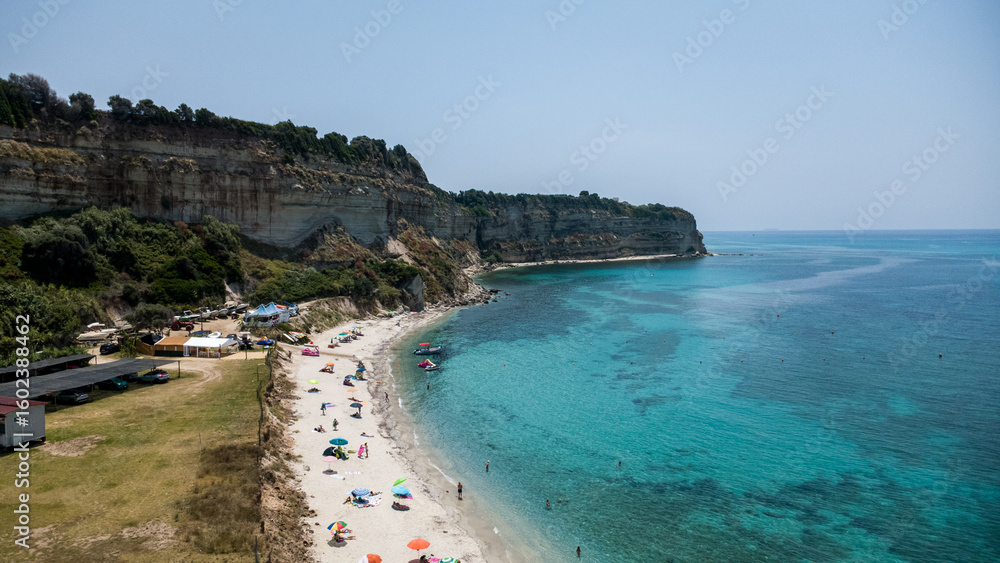 Obraz premium Beach Scene with Cliffs and Turquoise Waters – Aerial View of Santa Domenica, Calabria