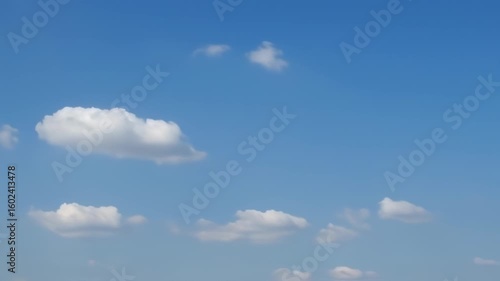 Fluffy clouds in a clear blue sky