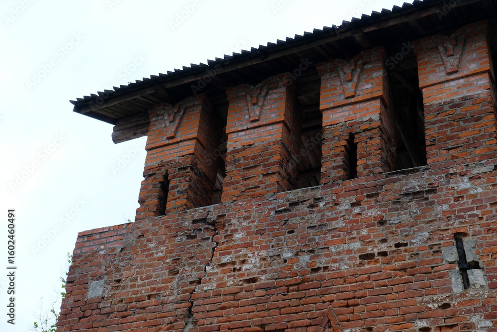 Fototapeta premium part of an old red brick wall