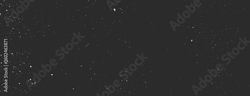 Dark black background with a starry texture. The black background features scattered white specks resembling stars in the night sky. Speckled wall texture background. Black background vector.