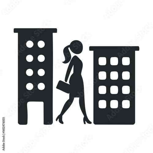 Silhouette of female professional walking between buildings