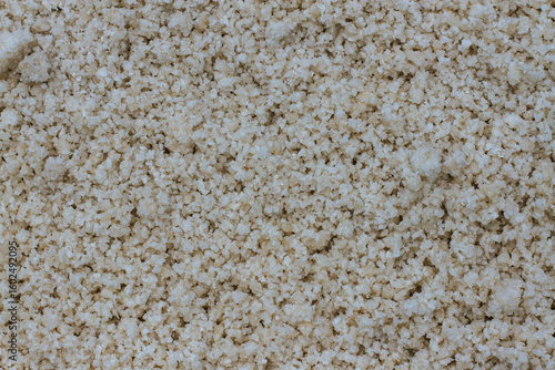 Pyramids of sea salt ready to be harvested in a salt farm at sunrise. Used as a seasoning in food, cosmetics and for food preservation.