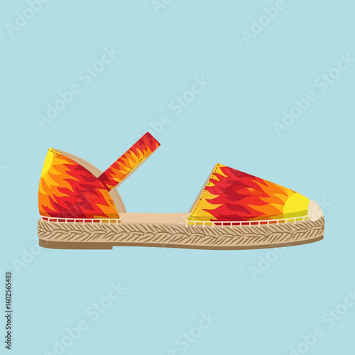 Single Espadrille Sandal with Flame Pattern on Light Blue Background