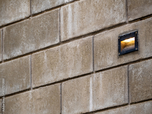 Recessed outdoor lighting in the brick wall