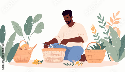 A focused Black man with a beard kneeling and arranging items in a wicker basket among plants.