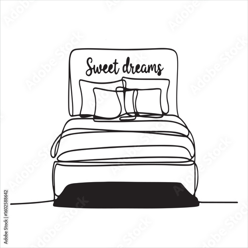 Cozy bed with sweet dreams message