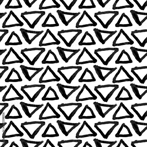 Abstract pattern with triangles of different directions. Wet brush with clear and blurred colors. Monochrome artistic. Repetitive pattern hand-drawn effects. Seamless texture of poor printing, grunge