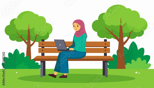 A smiling Muslim woman in a pink hijab works on her laptop while sitting on a bench.