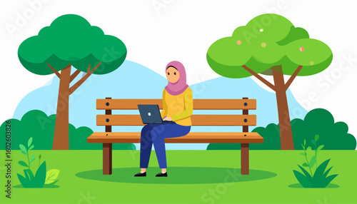 A woman in a pink hijab and yellow shirt working on a laptop while sitting on a park bench.