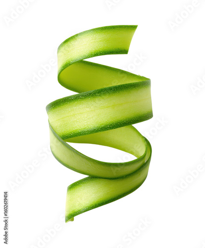 Zucchini peel curls elegantly. Vegetable garnish, green ribbon, raw food, vegetarian diet, healthy eating.