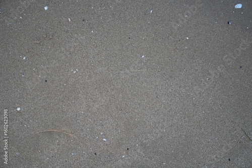 Gray asphalt texture with fine gravel and subtle surface irregularities. Ideal neutral background for urban design, architecture, and 3D materials.