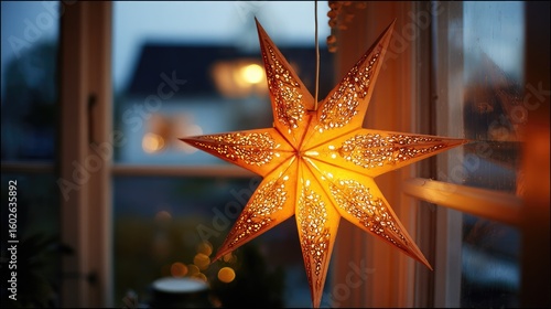 Illuminated star lantern by window