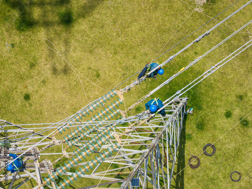 Aerial View of Linemen Working on a High-Voltage Power Line
